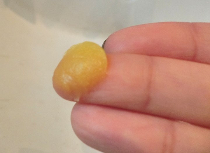 neals yard wild rose beauty balm on finger texture